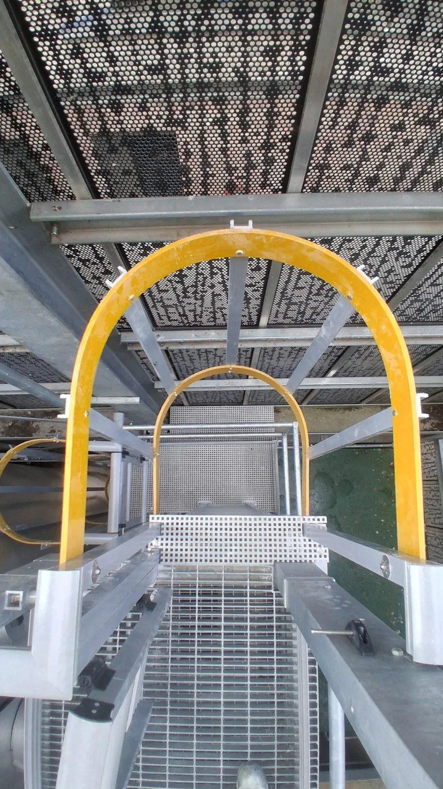 Hooped GRP ladder route beneath the buffer-vessel access platform